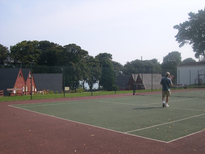 Playing tennis on the tennis court